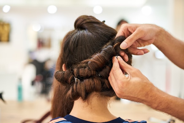 Stylist creating an elegant updo